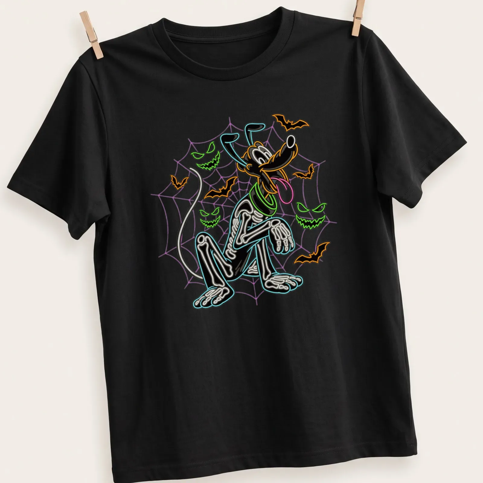 Neon skeleton dog with spiderwebs and bats in vibrant colors — printed on a unisex t-shirt