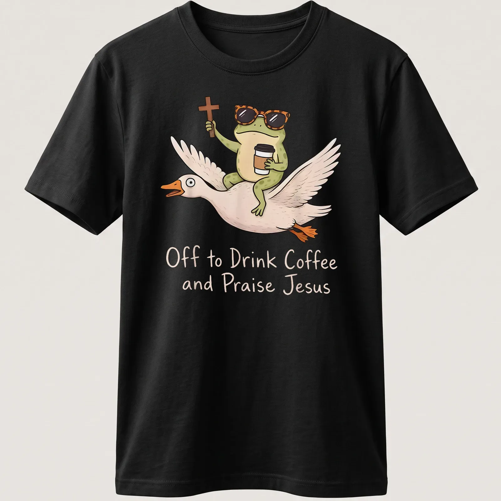 Cartoon frog riding a goose, with the phrase Off to Drink Coffee and Praise Jesus printed above. — printed on a unisex t-shirt