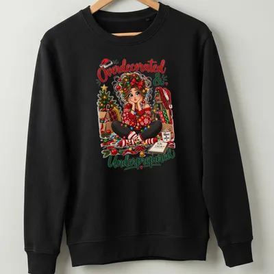 Colorful cartoon of a girl overwhelmed with Christmas decorations and humorous text above — printed on a unisex sweatshirt