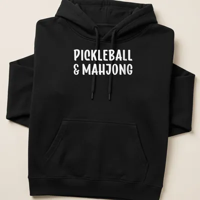 Bold typography design featuring pickleball and mahjong text in white — printed on a unisex hoodie
