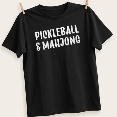 Bold typography design featuring pickleball and mahjong text in white