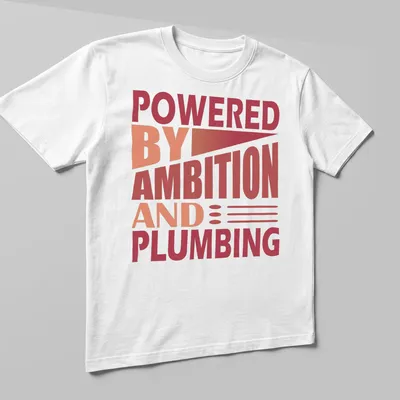 Bold typography t-shirt with the phrase 'Powered By Ambition And Plumbing' in red and orange. — printed on a unisex t-shirt (angled view)