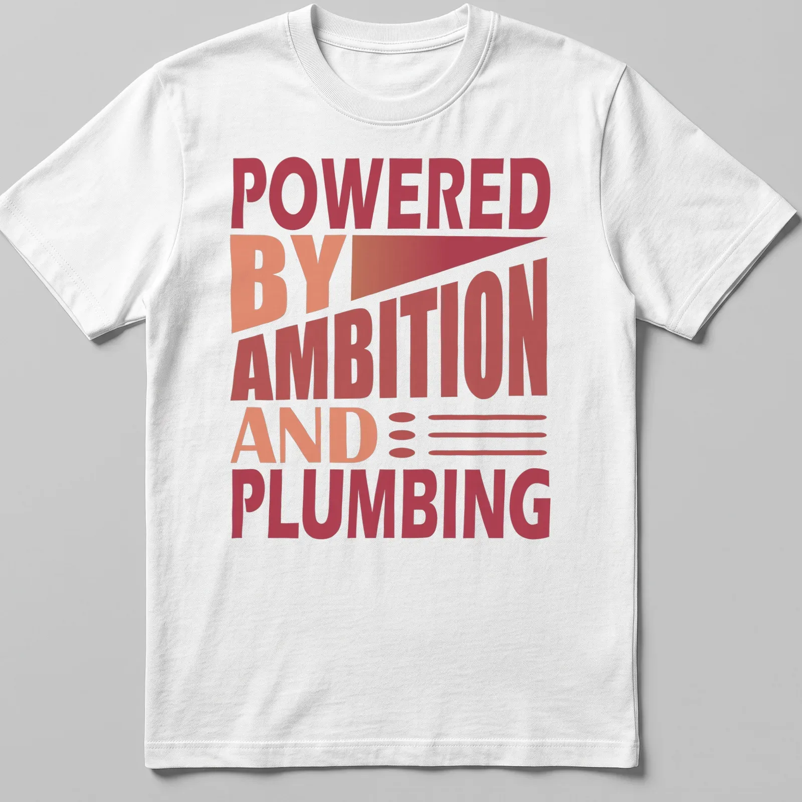 Bold typography t-shirt with the phrase 'Powered By Ambition And Plumbing' in red and orange. — printed on a unisex t-shirt