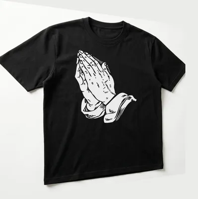 Text-based graphic of praying hands with religious phrases in white. — printed on a unisex t-shirt (angled view)