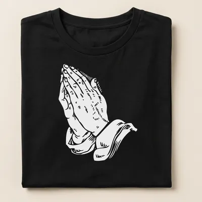 Text-based graphic of praying hands with religious phrases in white. — printed on a women's shirt