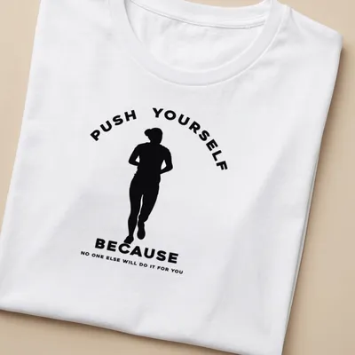 Minimalist motivational running t-shirt with bold text in black and white — printed on a women's shirt