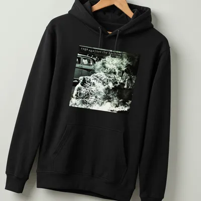 Vintage photo print of a protest with text 'rage against the machine' in black and white — printed on a unisex hoodie