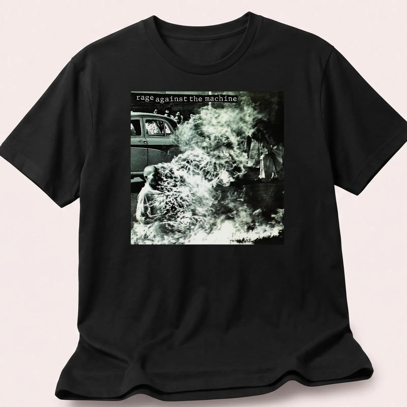 Vintage photo print of a protest with text 'rage against the machine' in black and white — printed on a unisex t-shirt