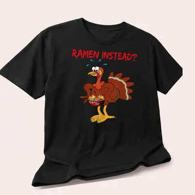 Cartoon turkey holding a ramen bowl with the text 'RAMEN INSTEAD?' — printed on a unisex t-shirt (angled view)