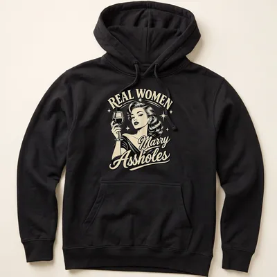 Retro shirt with the quote 'REAL WOMEN Marry Assholes' and a glamorous woman illustration — printed on a unisex hoodie