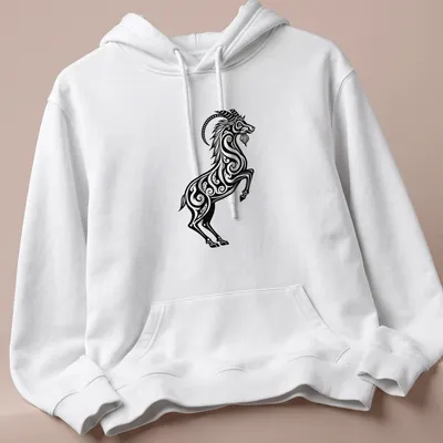 Black and white tribal tattoo design of a Capricorn sea goat — printed on a unisex hoodie