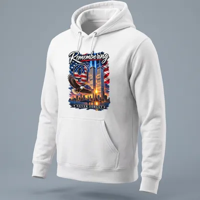 Eagle flying over Twin Towers with the text 'Remembering 9 NEVER FORGET' in patriotic colors — printed on a unisex hoodie