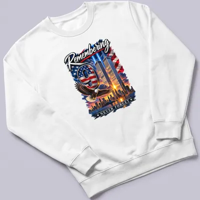 Eagle flying over Twin Towers with the text 'Remembering 9 NEVER FORGET' in patriotic colors — printed on a unisex sweatshirt
