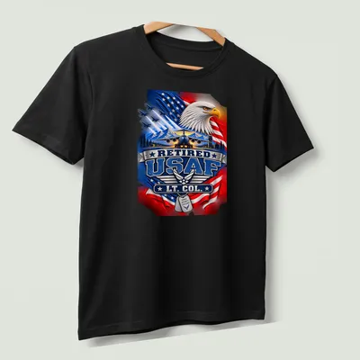 Patriotic T-shirt featuring an eagle and military aircraft with Retired USAF LT. COL. text — printed on a unisex t-shirt (angled view)