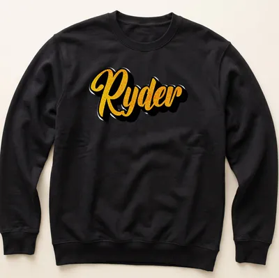 Personalized boys T-shirt with bold yellow script reading 'Ryder' on black — printed on a unisex sweatshirt