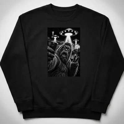 Realistic black and white print of Sasquatch taking a selfie with UFOs — printed on a unisex sweatshirt