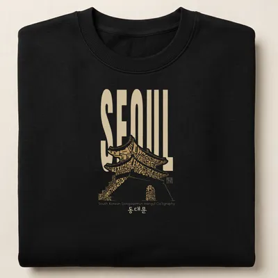 T-shirt featuring Hangul calligraphy of 'SEOUL South Korean Dongdaemun' with traditional architecture styling — printed on a unisex sweatshirt