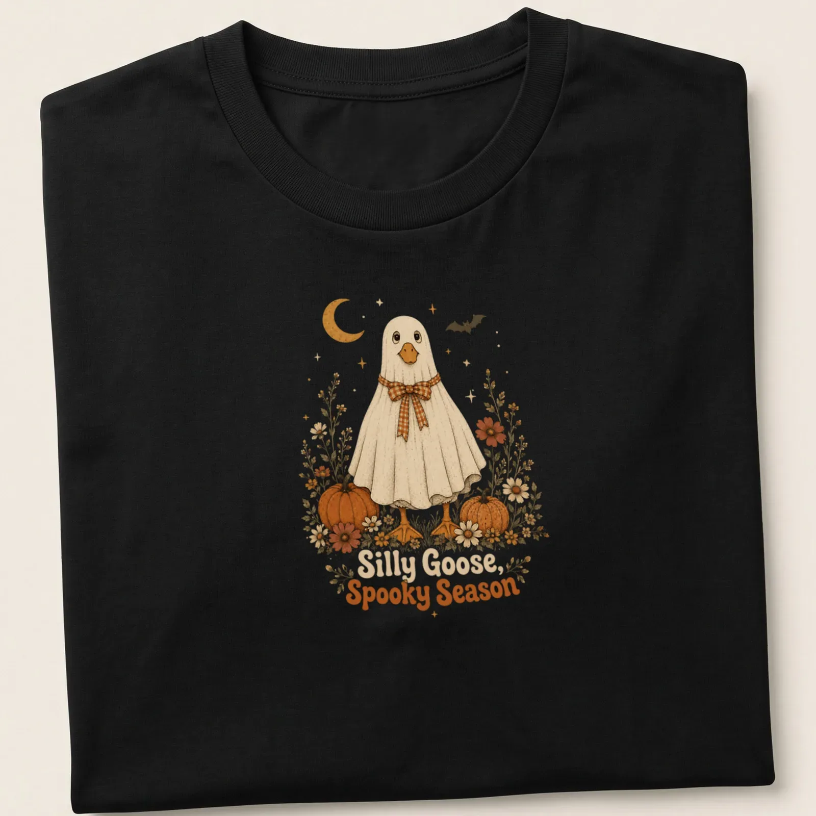 Cute ghost goose with floral pumpkins and text in vintage style — printed on a unisex t-shirt