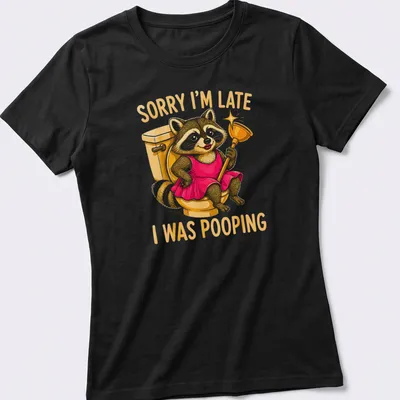 Cartoon raccoon in a dress with humorous text about being late due to pooping — printed on a women's shirt