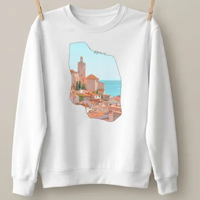 Watercolor coastal village scene with 'spain' text in soft colors — printed on a unisex sweatshirt