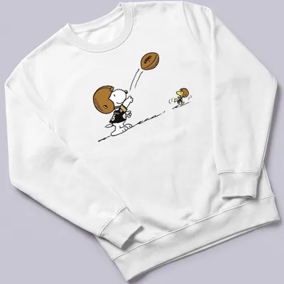 Cartoon Snoopy character playing football with Pittsburgh Steelers text above — printed on a unisex sweatshirt