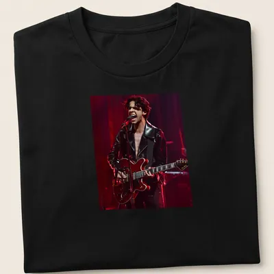 Illustration of a musician with a guitar in black, red, and grey. — printed on a unisex t-shirt