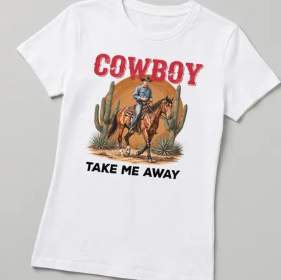Realistic cowboy riding a horse in the desert with the text 'COWBOY TAKE ME AWAY' — printed on a women's shirt
