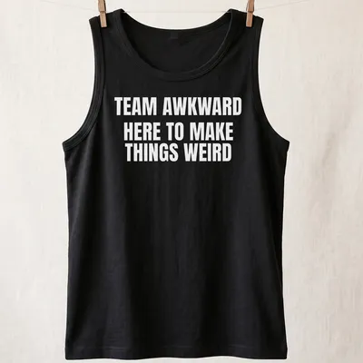Bold typography with the phrase Team Awkward Here To Make Things Weird on white background — printed on a tank top