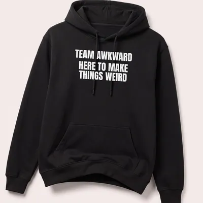 Bold typography with the phrase Team Awkward Here To Make Things Weird on white background — printed on a unisex hoodie