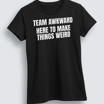 Bold typography with the phrase Team Awkward Here To Make Things Weird on white background — printed on a women's shirt