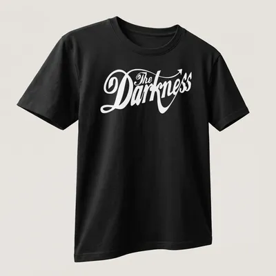 White cursive script 'The Darkness' with an arrow tail on a black — printed on a unisex t-shirt (angled view)