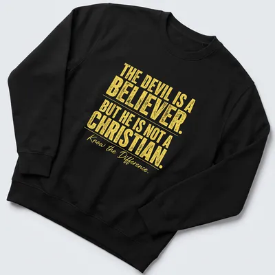 Bold typography t-shirt with the phrase about the devil's beliefs in yellow and white — printed on a unisex sweatshirt
