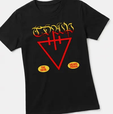 Vintage t-shirt featuring a stylized devil graphic and text 'The Devil Wears Prada' in red and yellow — printed on a women's shirt