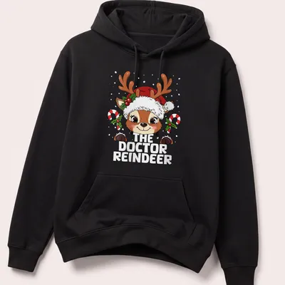 Kawaii style T-shirt featuring a cute reindeer and festive lettering — printed on a unisex hoodie