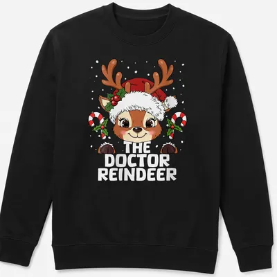 Kawaii style T-shirt featuring a cute reindeer and festive lettering — printed on a unisex sweatshirt