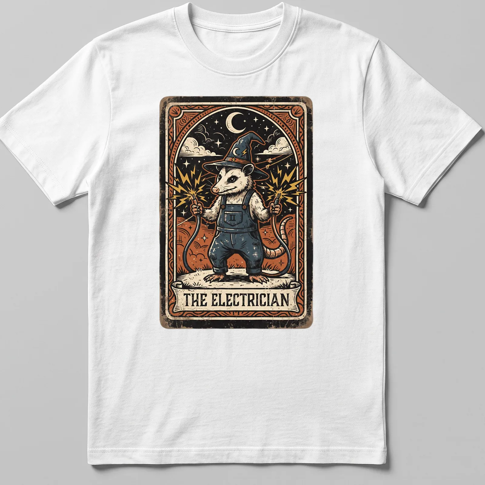 Opossum illustrated in vintage tarot style with 'THE ELECTRICIAN' text — printed on a unisex t-shirt