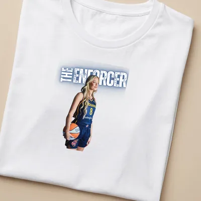 Illustration of a basketball player with 'THE ENFORCER' text in navy, yellow, and white. — printed on a women's shirt