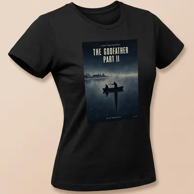 Minimal illustration of silhouetted figures in a boat, with text from The Godfather Part II — printed on a women's shirt