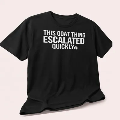 Bold typography saying 'THIS GOAT THING ESCALATED QUICKLY' on a white — printed on a unisex t-shirt (angled view)