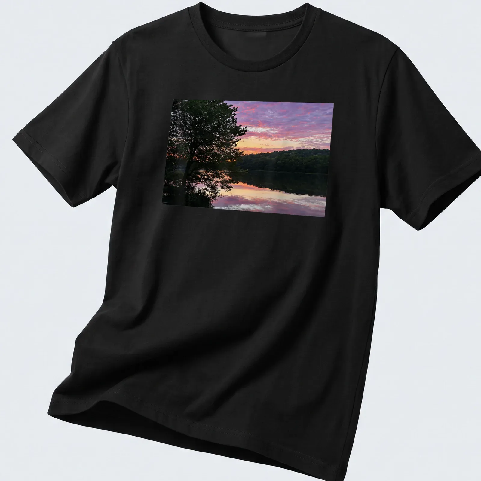 Photographic print of a serene lake at sunrise with colorful reflections and text. — printed on a unisex t-shirt