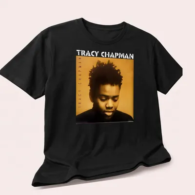 Vintage-style t-shirt featuring Tracy Chapman's name in bold lettering — printed on a unisex t-shirt (angled view)