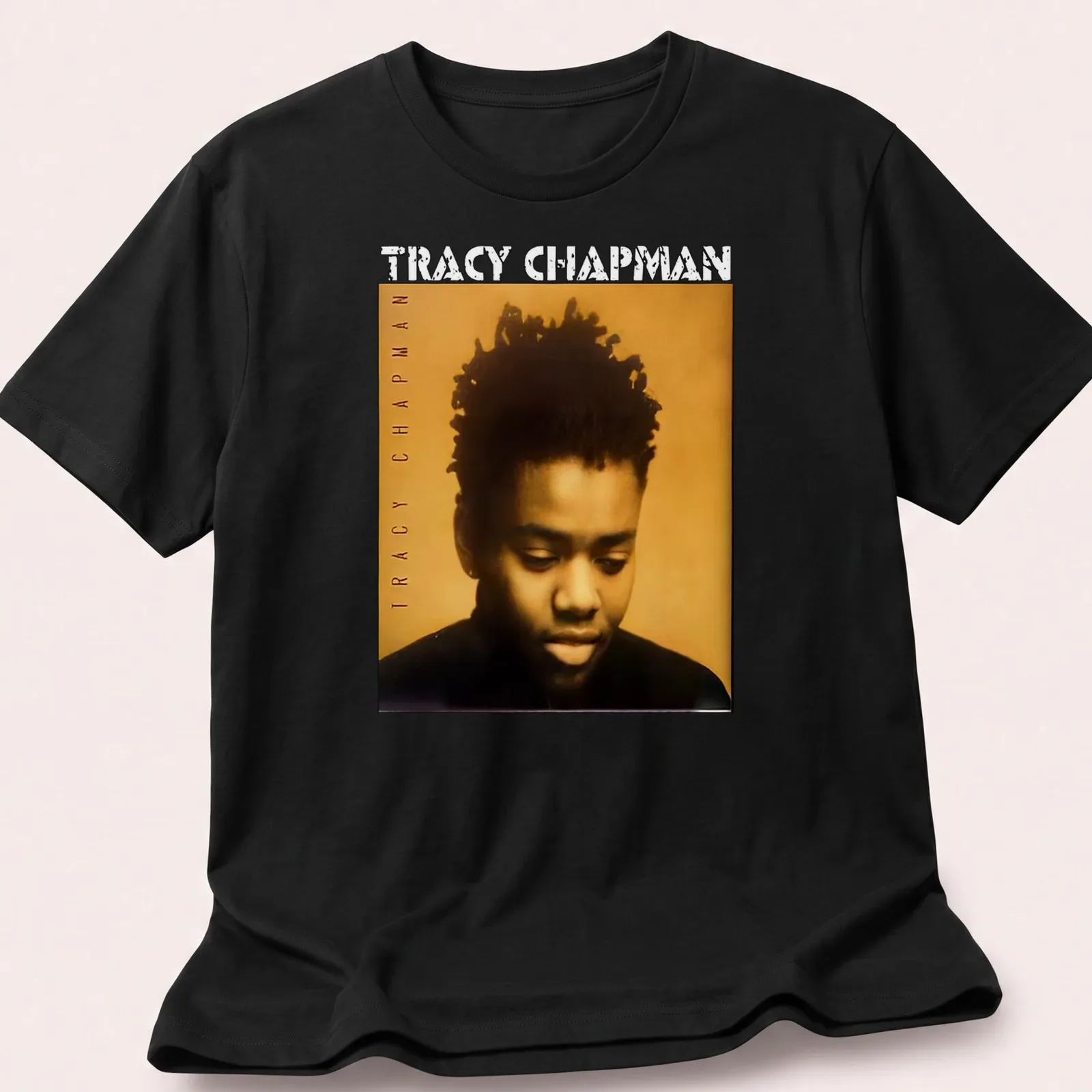 Vintage-style t-shirt featuring Tracy Chapman's name in bold lettering — printed on a unisex t-shirt