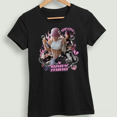 Playful illustration of a stylish woman with urban elements and the text Trap Kitty Baby Miko — printed on a women's shirt