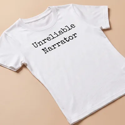 Black and white shirt with the text 'Unreliable Narrator' and a bookworm illustration — printed on a women's shirt