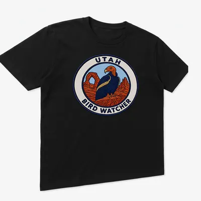 Vintage patch-style t-shirt featuring a California Condor and text for bird watchers — printed on a unisex t-shirt (angled view)