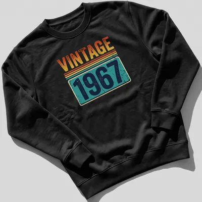 Distressed Vintage 1967 T-shirt with retro typography in orange, yellow, teal, navy, and white — printed on a unisex sweatshirt