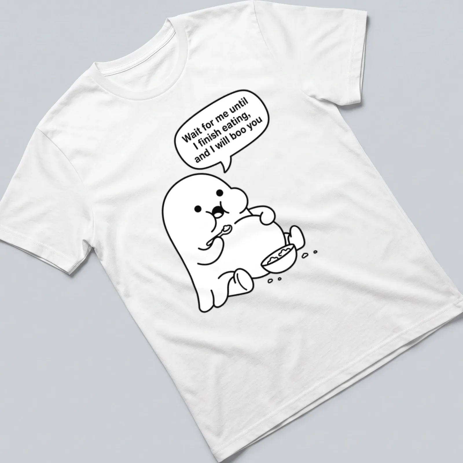 Kawaii line-art ghost t-shirt with humorous text about eating and booing — printed on a unisex t-shirt