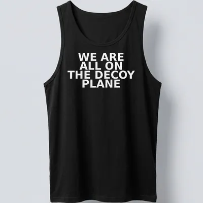 Bold typography t-shirt featuring the phrase 'WE ARE ALL ON THE DECOY PLANE' — printed on a tank top