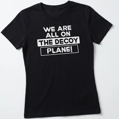Bold typography T-shirt featuring the phrase We Are All On The Decoy Plane! — printed on a women's shirt