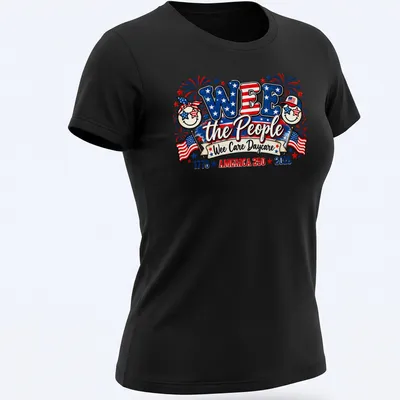 Colorful festive design featuring smiling faces and patriotic elements with text — printed on a women's shirt